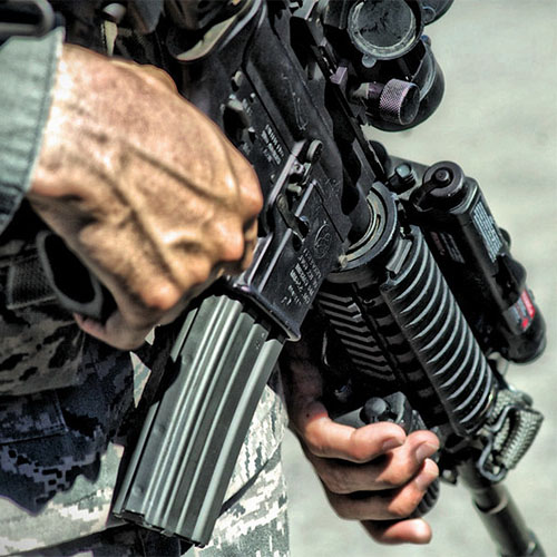 Assault rifle in the hands of a military man